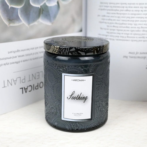 scented candles in embossed glass jars